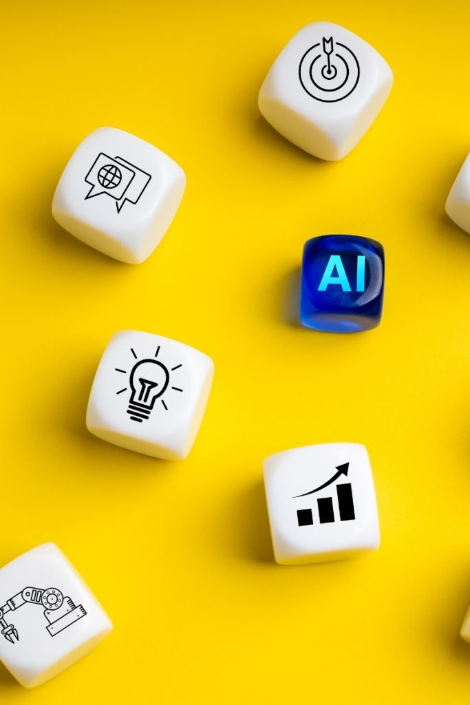 Cubes showing AI, a search icon and a chart against yellow