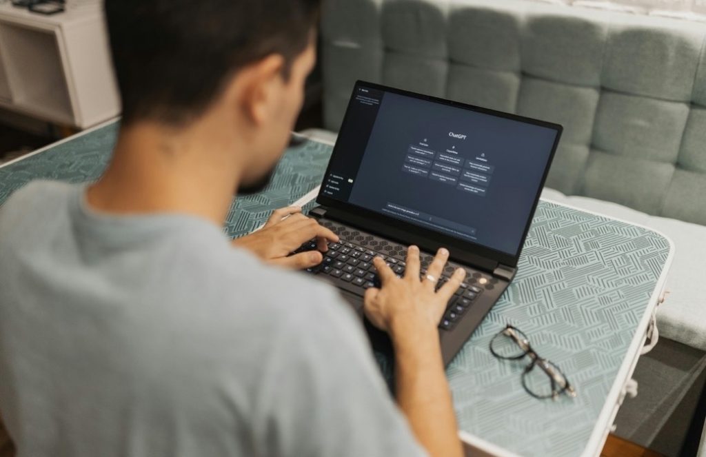 Person programming at a laptop computer