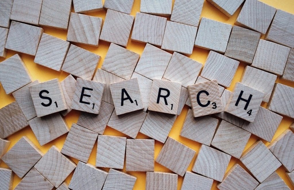 Wood letter tiles form the word SEARCH
