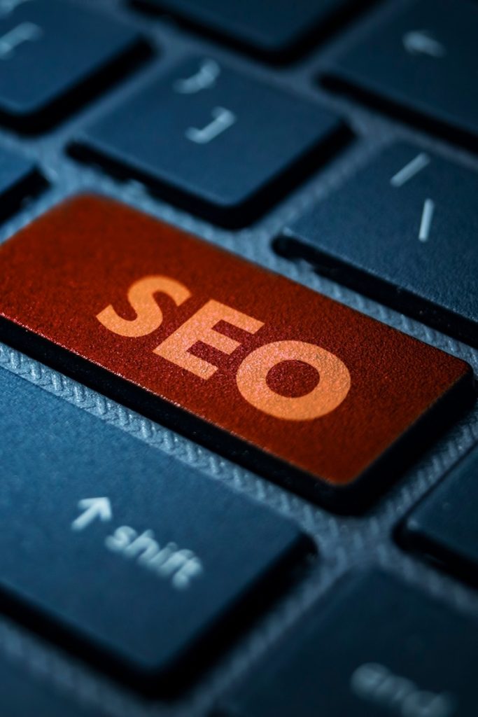 Computer keyboard featuring an orange SEO button